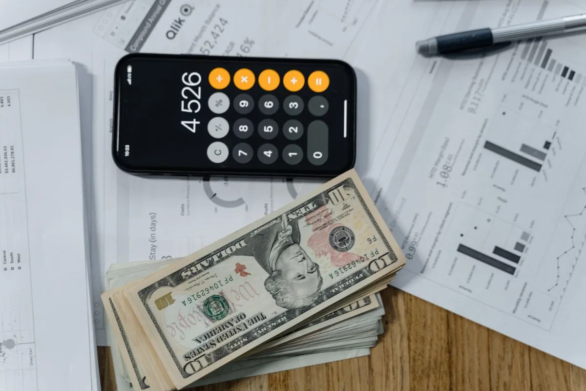 Outsourced accounting planning session with charts and documents