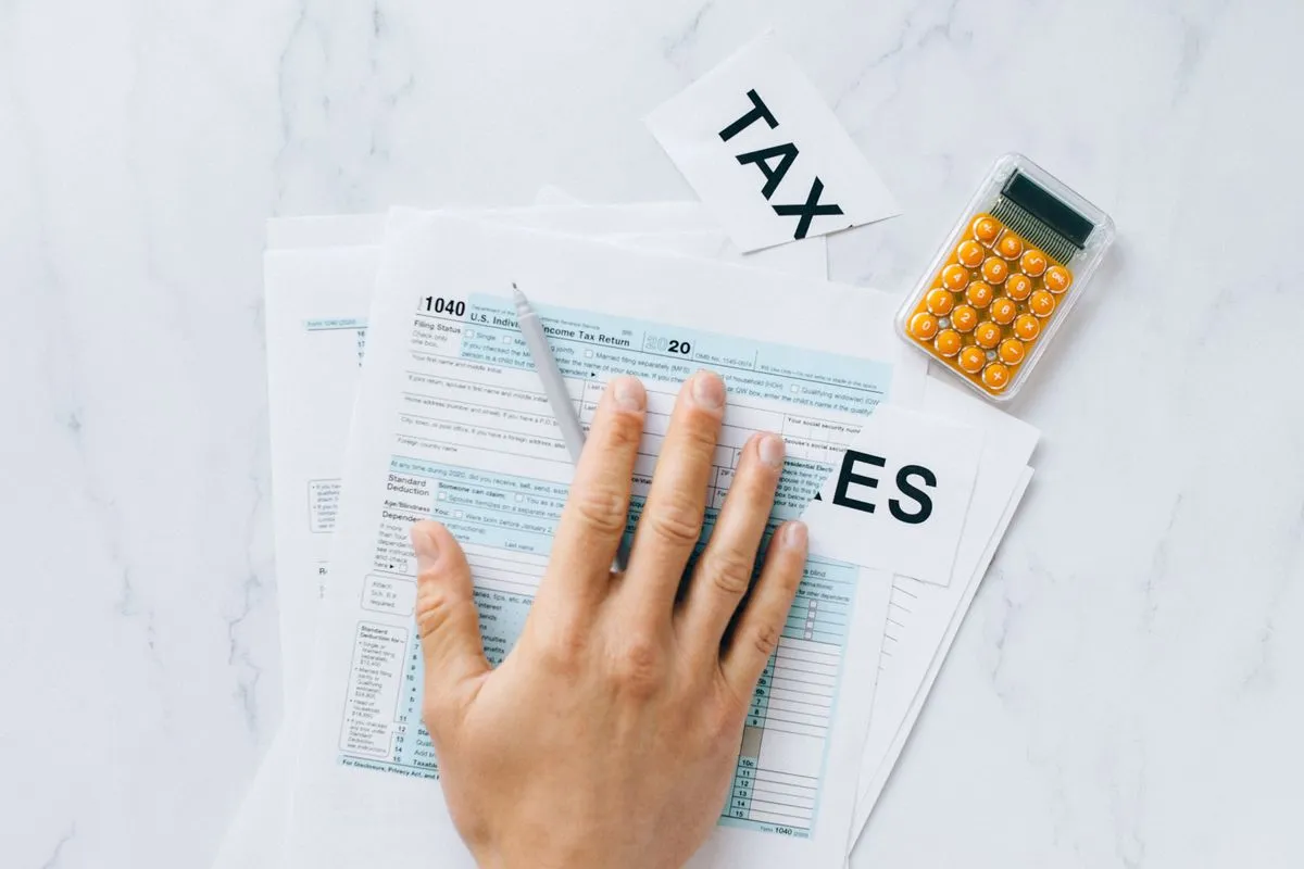 CPA reviewing tax documents and preparing a filing report