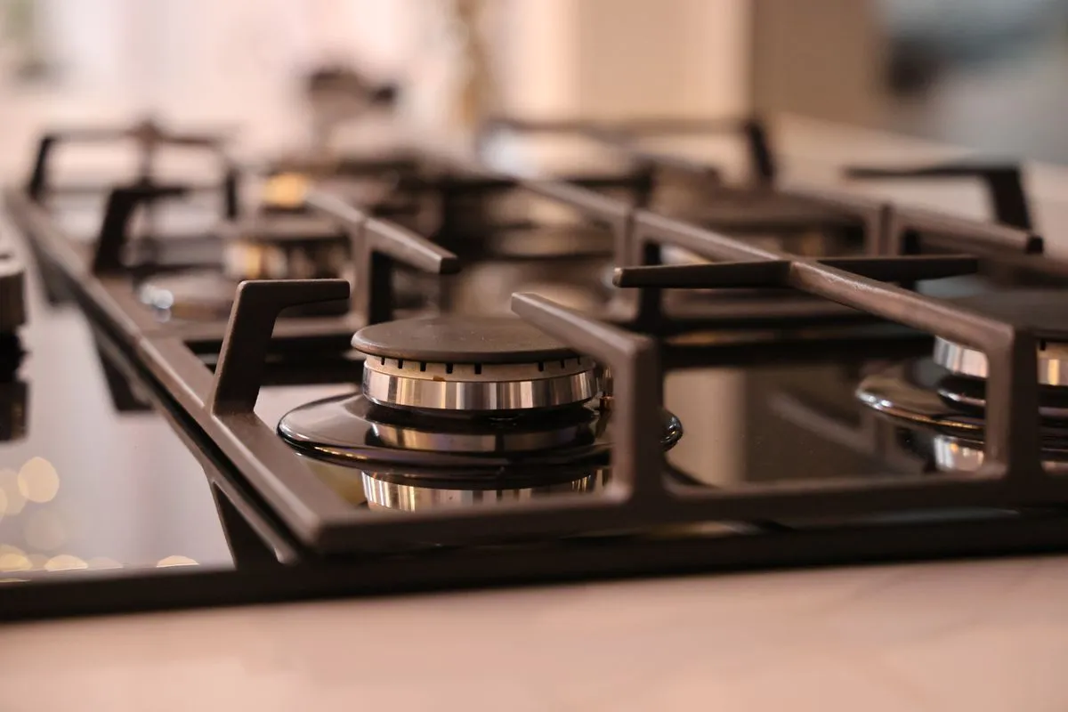 Gas range repair work with ignition components checked on site