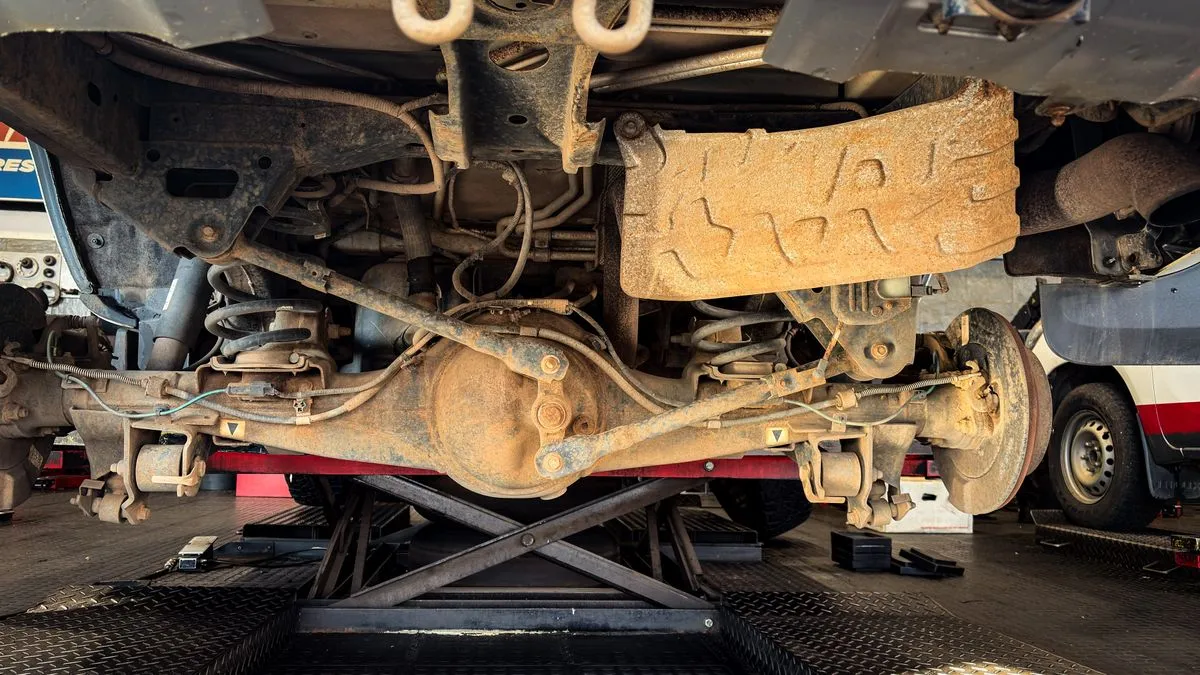 Vehicle on a lift during a brake inspection and repair