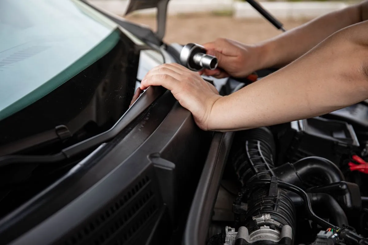 Auto air conditioning service in a clean workshop bay