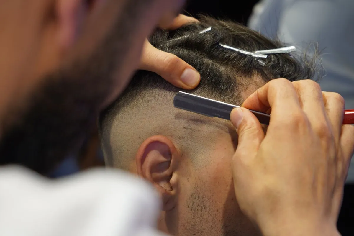 Close-up of a clean beard trim and shave in progress
