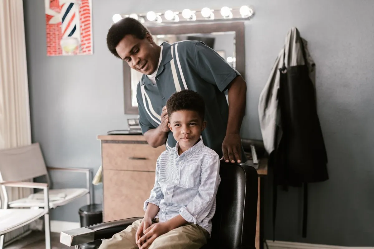 A fresh kids haircut with a clean neckline and polished finish
