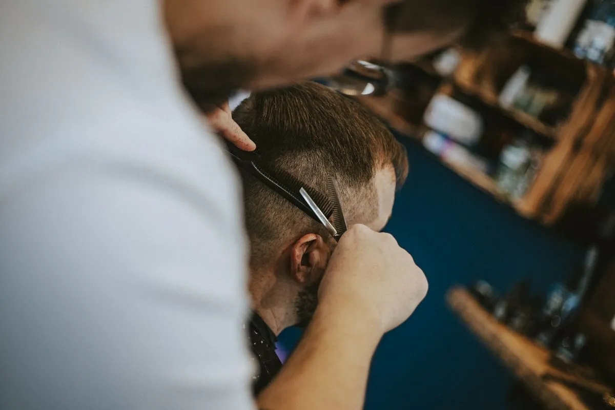Clean skin fade inside a modern men's barbershop