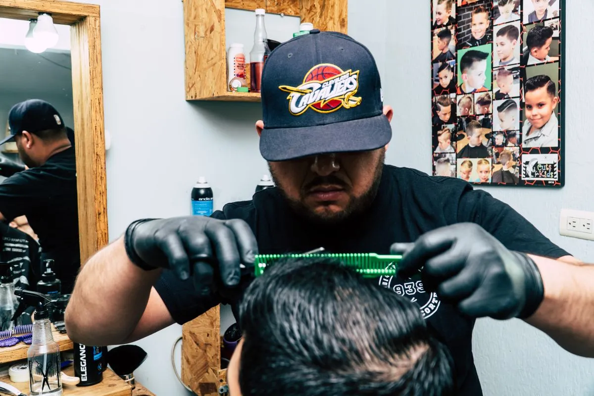 Man receiving a modern men's hair color service in a stylish studio