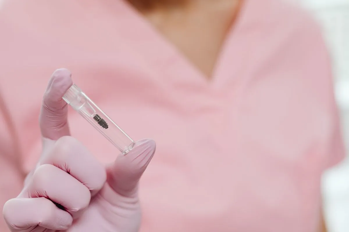 Dentist reviewing implant scans with a patient during a consultation
