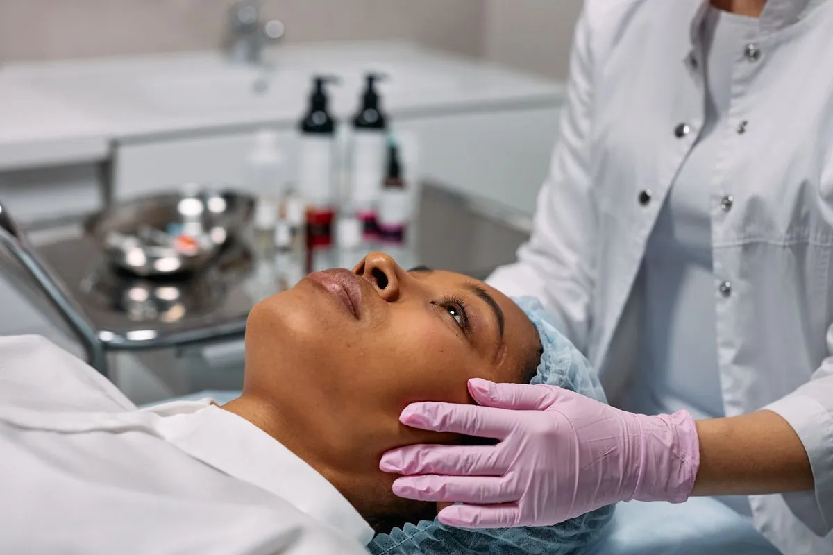 Skin care specialist reviewing treatment options