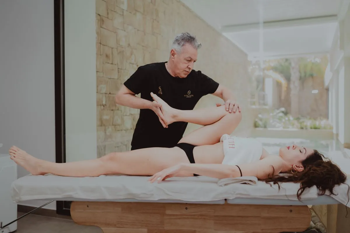 Patient performing guided rehab exercises in a physical therapy clinic