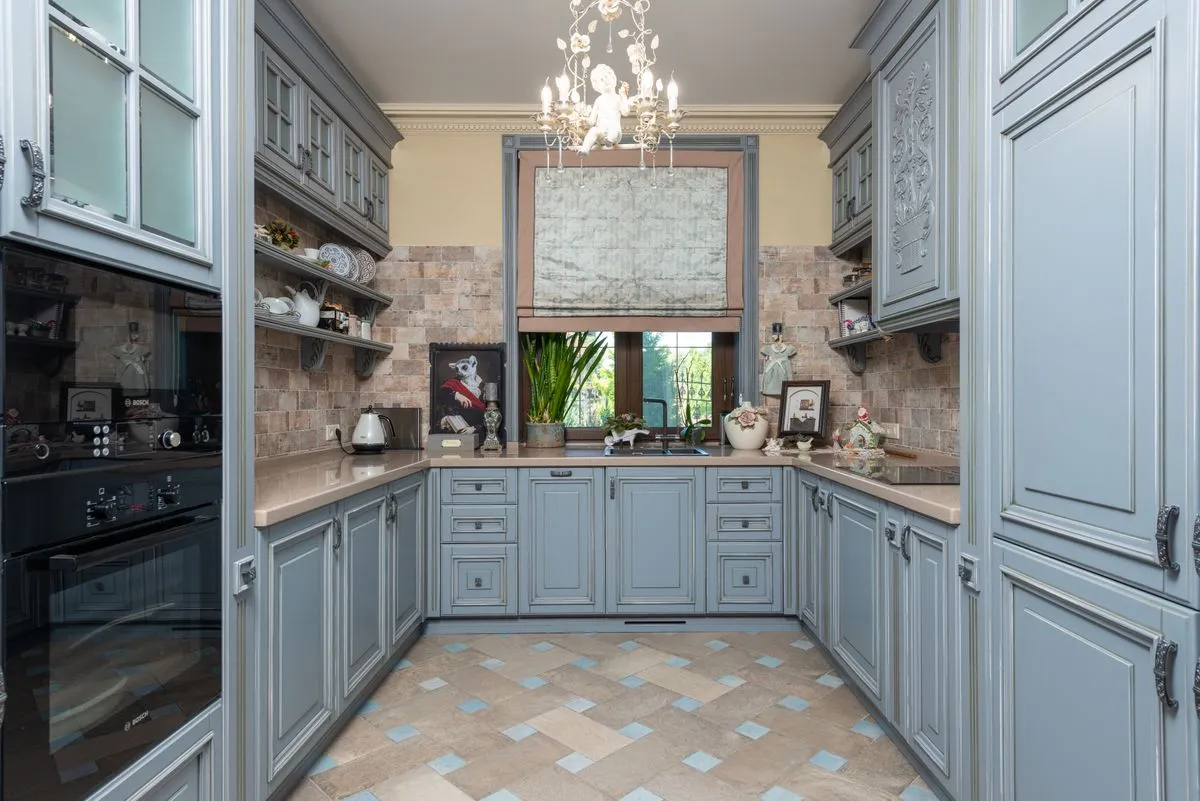 Bright modern kitchen with custom kitchen cabinets and matte brass hardware