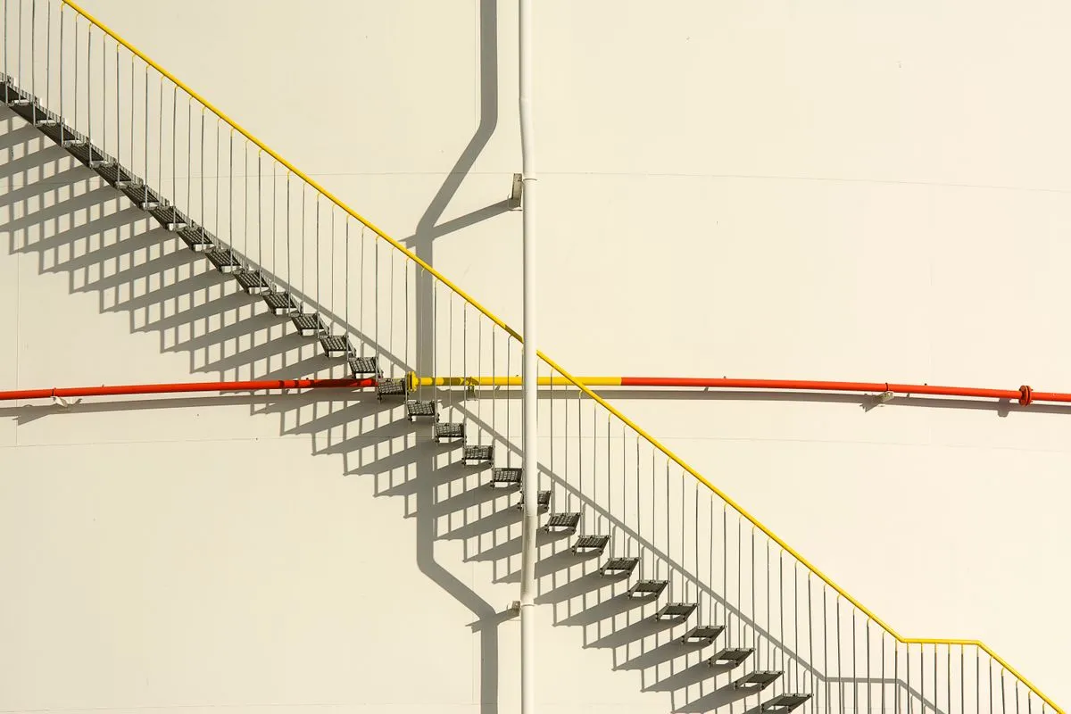 Floating staircase installation with wood treads and black steel frame
