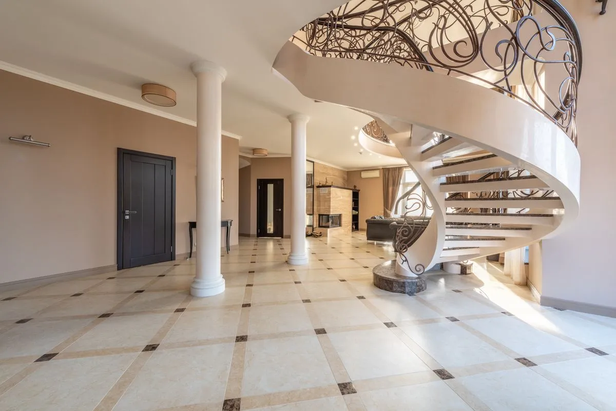 Open riser stairs in a bright contemporary hallway
