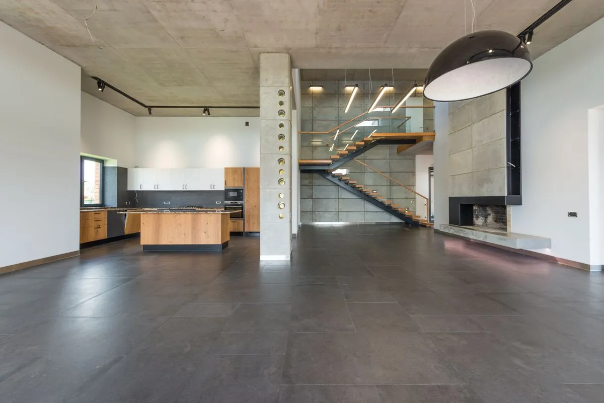 Modern staircase design with glass railing in a luxury interior