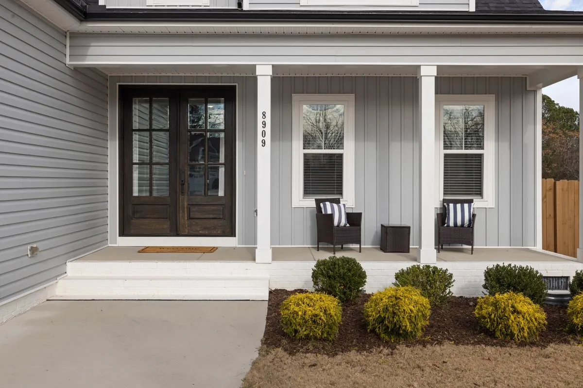 Installed steel security door with black handleset