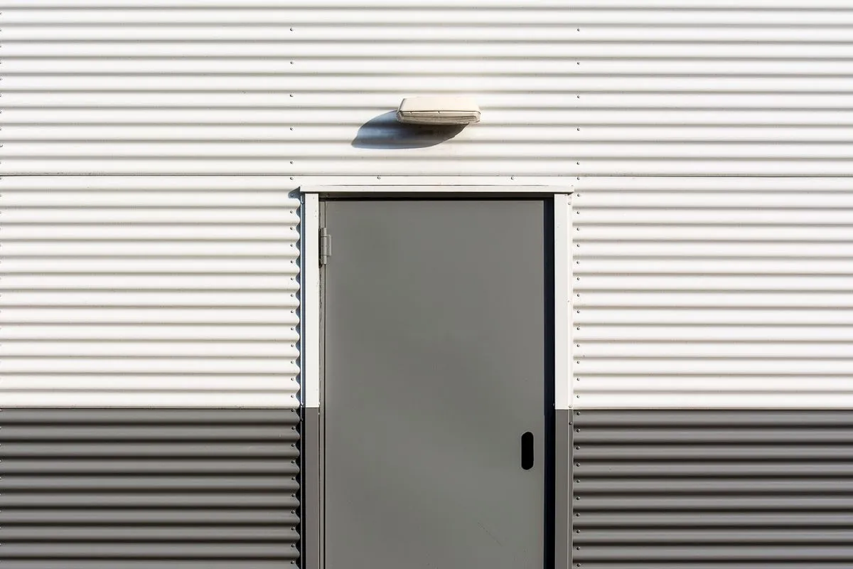 Finished residential garage door installation with a modern insulated panel door