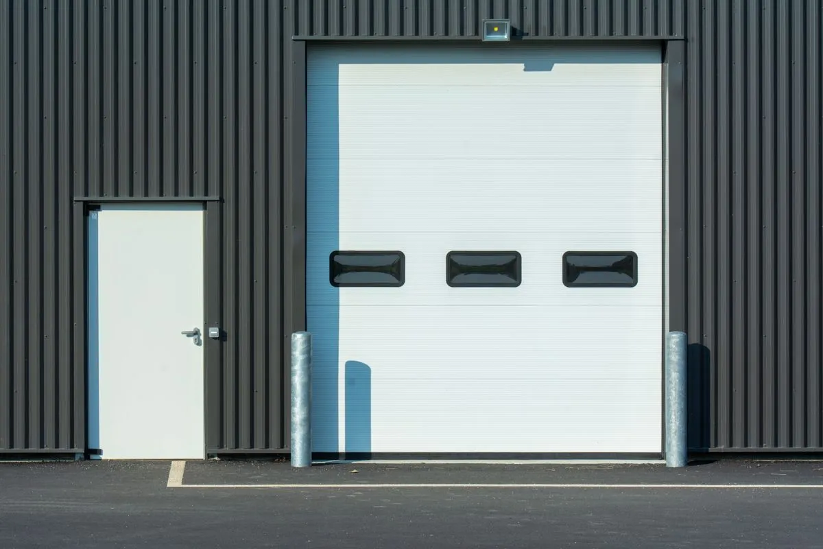 Safety sensor alignment during a garage door repair service visit