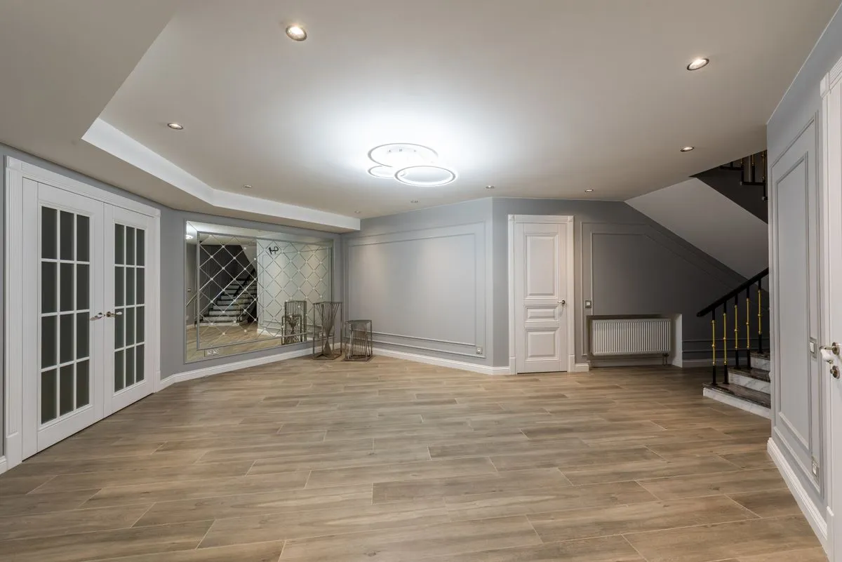 Suspended ceiling contractor work in a modern office with access panels