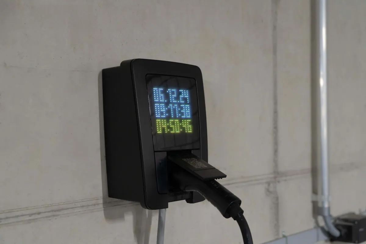 Outdoor EV charger installation on an exterior wall with weatherproof hardware