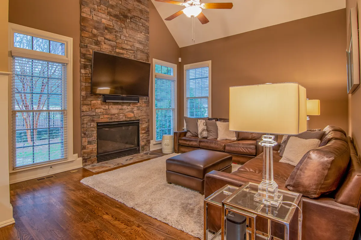 Finished recessed lighting installation in a bright living room