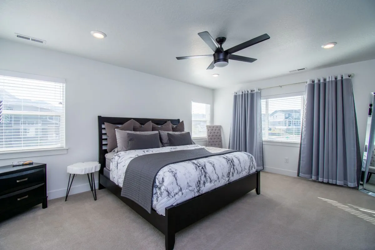 Electrician installing modern recessed lighting in a finished living room