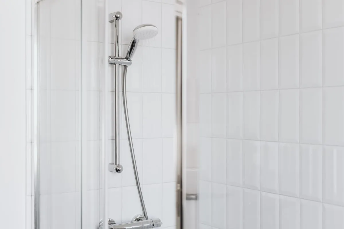 White subway tiles installed around a bright bathroom vanity