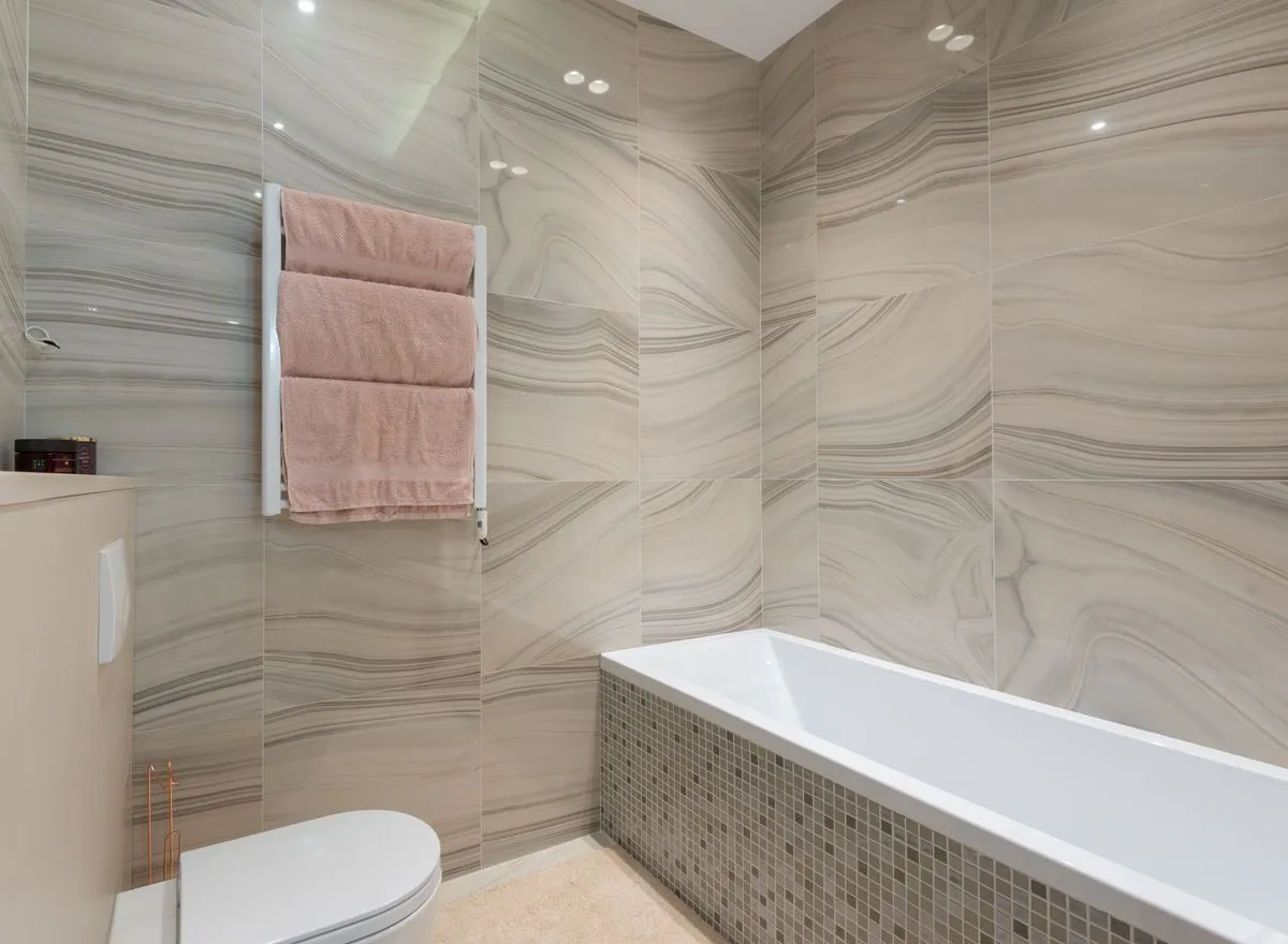 Blue patterned feature wall with carefully aligned grout joints