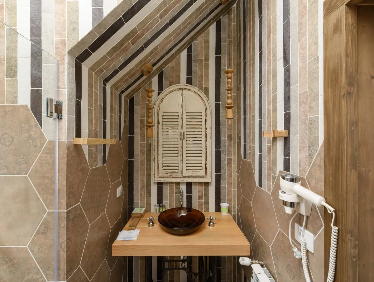 Completed shower wall with clean corners and sealed grout