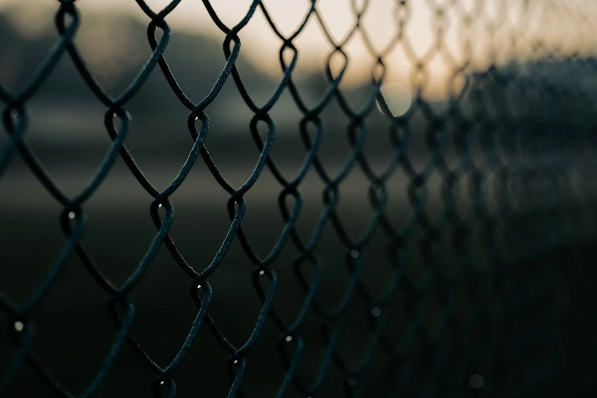 Vinyl fence installation on a residential backyard with a clean privacy finish