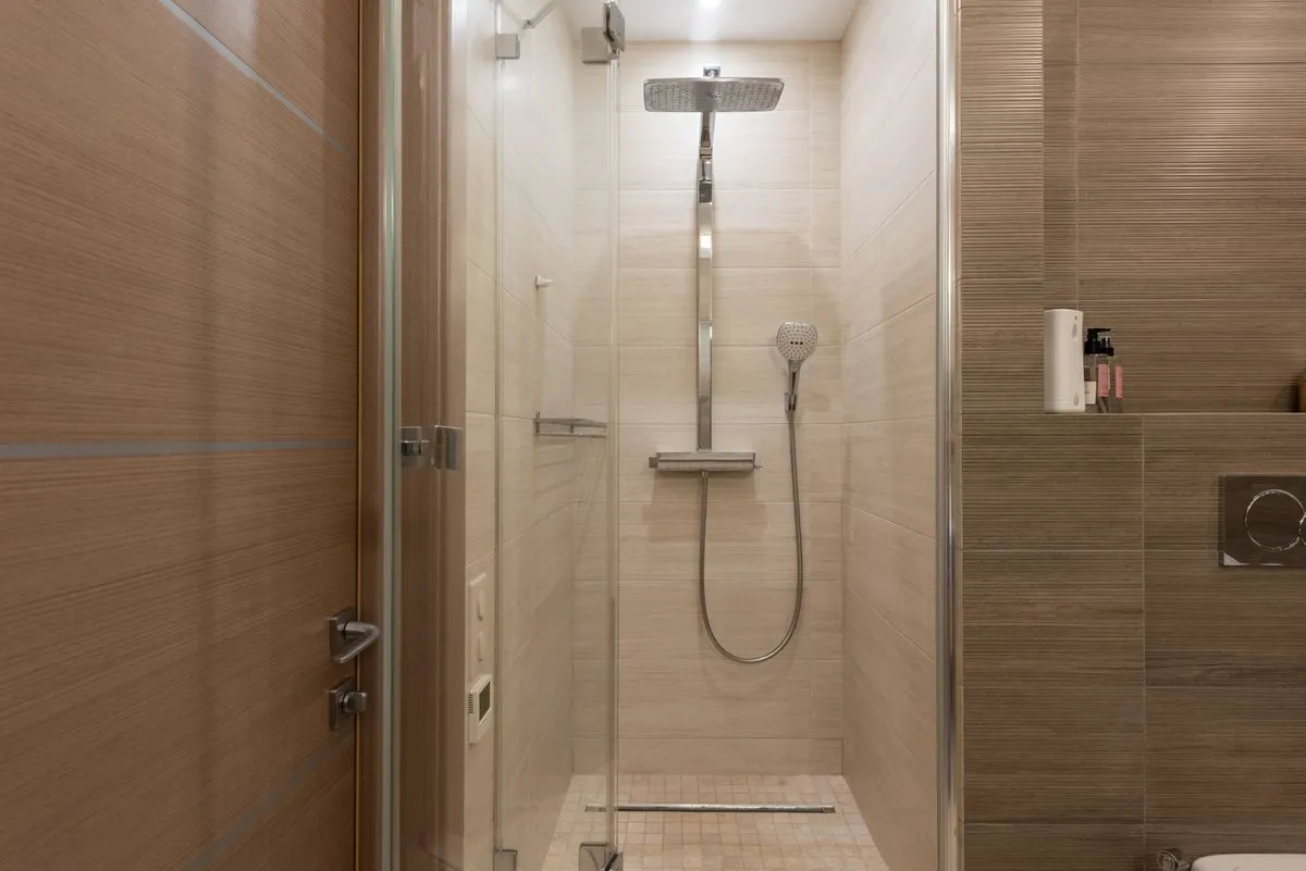 Modern bathroom remodel contractor installation with floating vanity and black fixtures