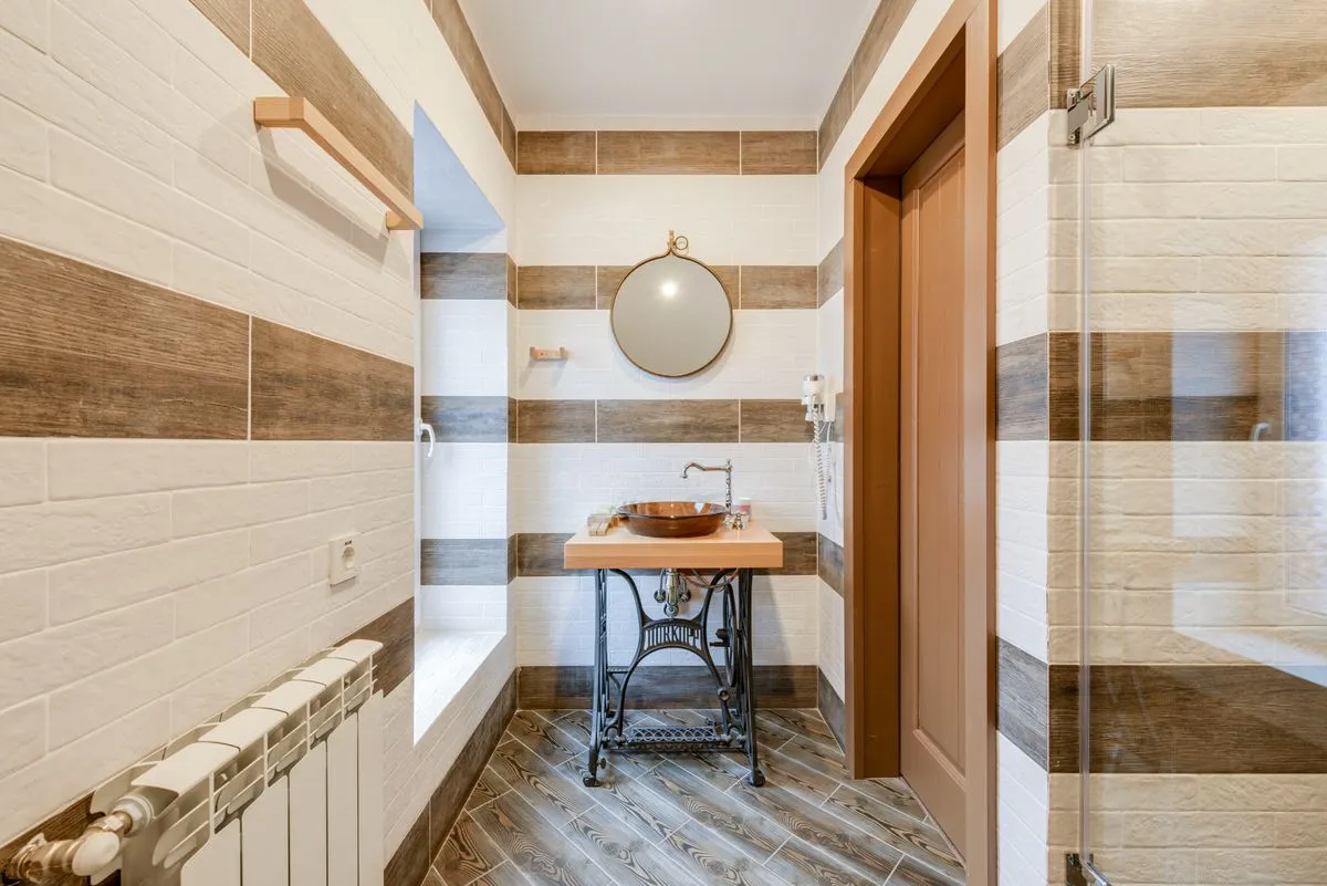 Small bathroom remodel with space-saving vanity and bright lighting