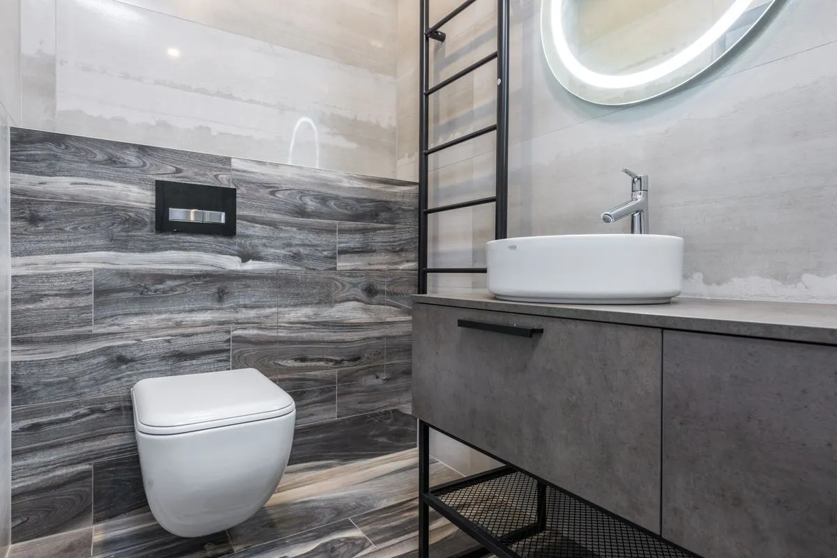 Primary bathroom remodeling project featuring a double sink vanity and glass shower