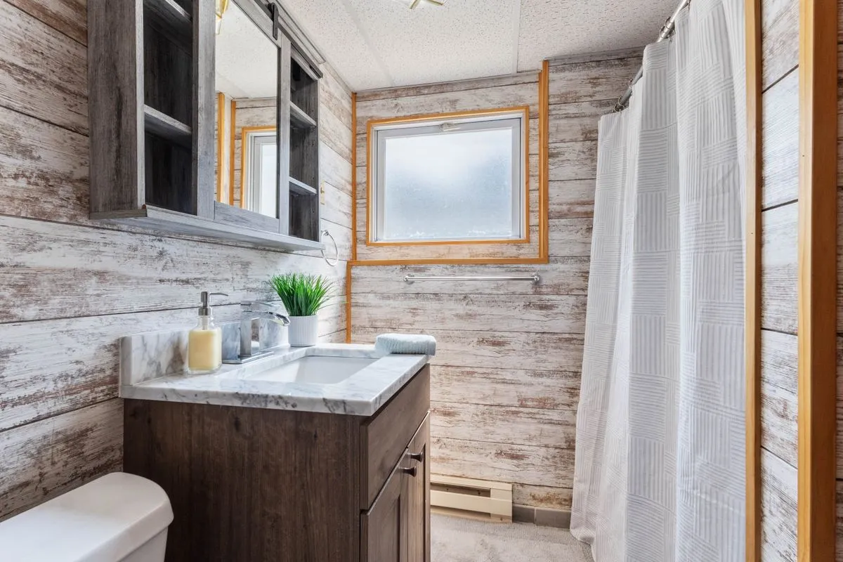 Tub to shower conversion completed with waterproof walls and matte tile