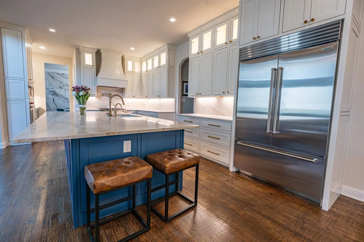 Bright kitchen remodeling project with shaker cabinets and quartz counters