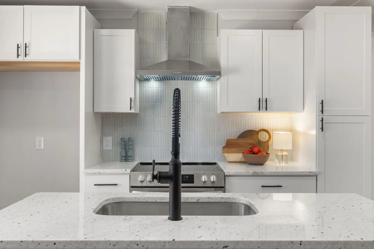 Updated kitchen with custom storage, improved lighting, and clean finishes