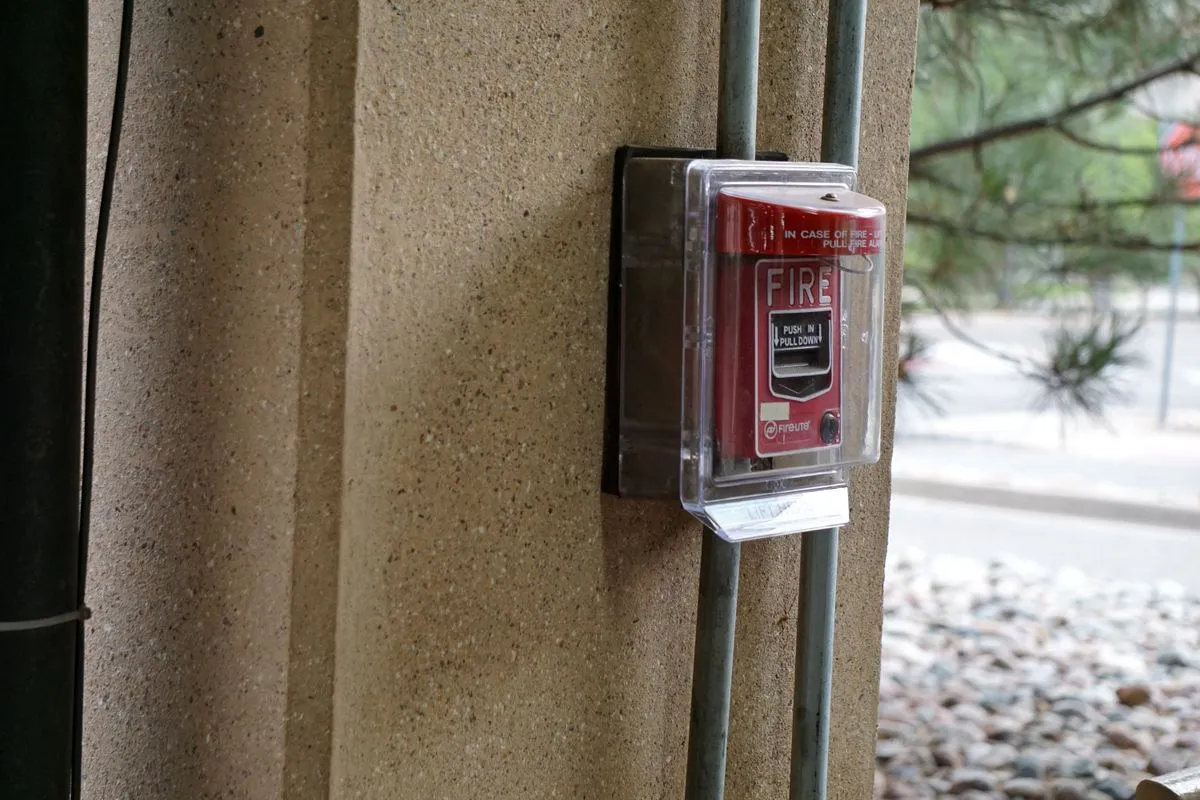 Warehouse security setup with alarm sensors and surveillance monitoring