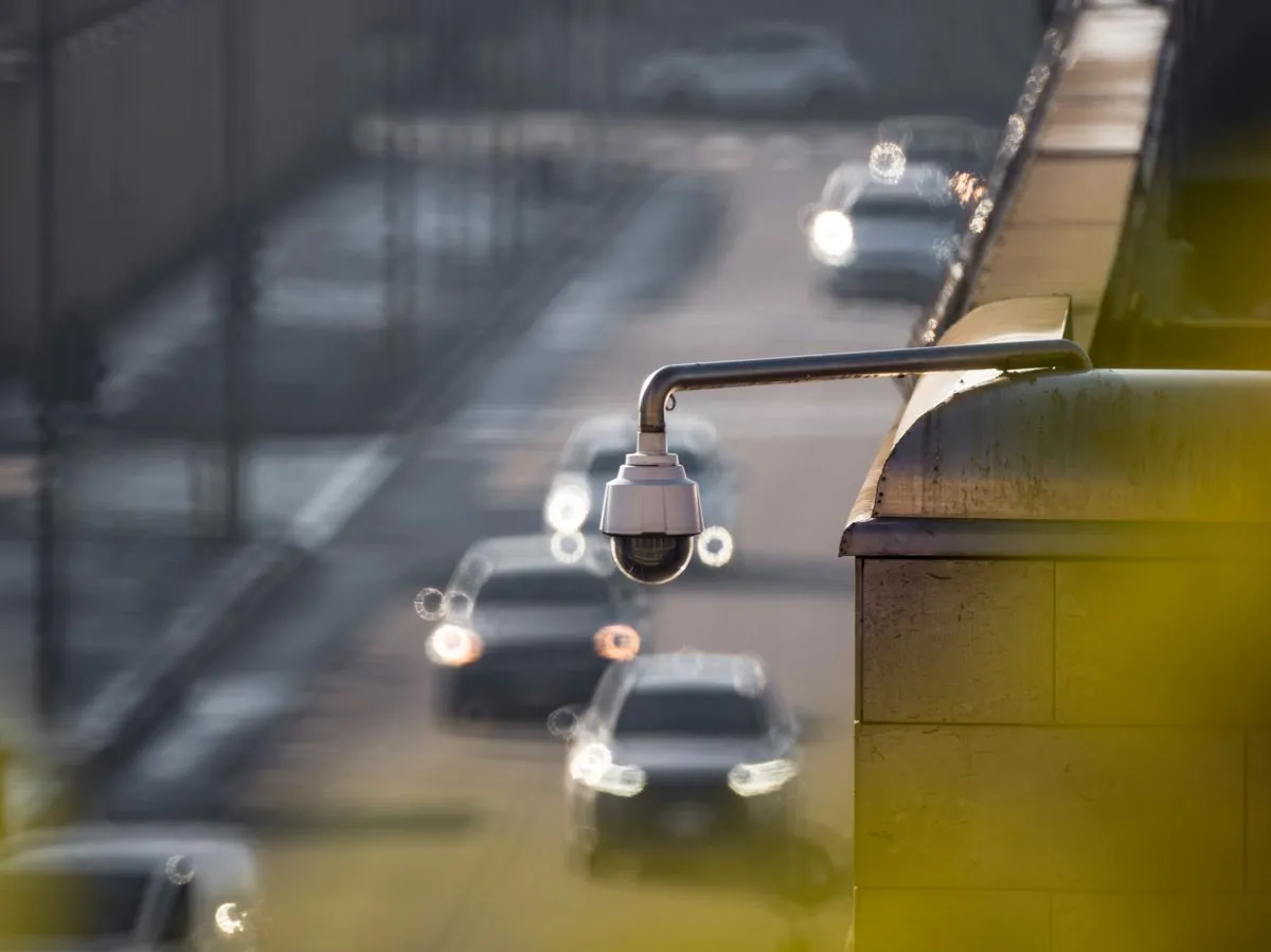 Outdoor surveillance cameras installed above a driveway for full coverage