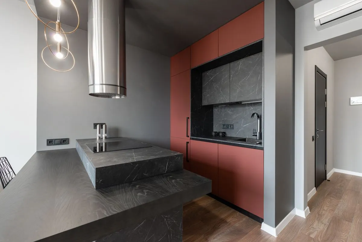 Before and after cabinet painting service in a modern kitchen