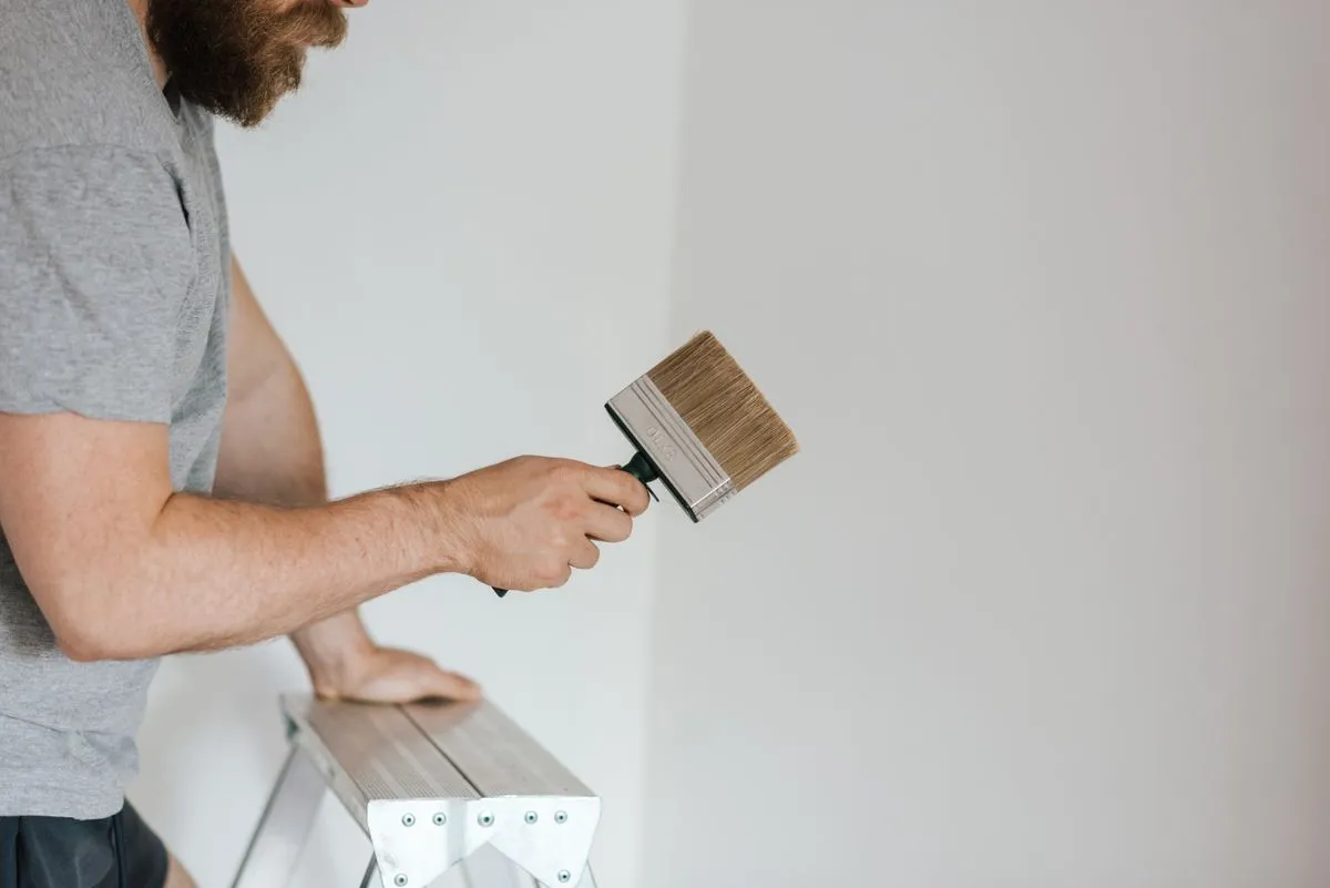 Bedroom repaint with soft neutral walls and clean trim