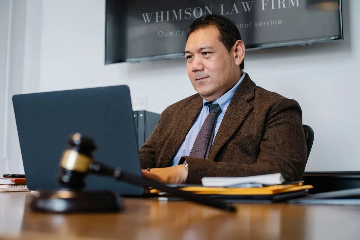 Immigration attorney reviewing documents with a client