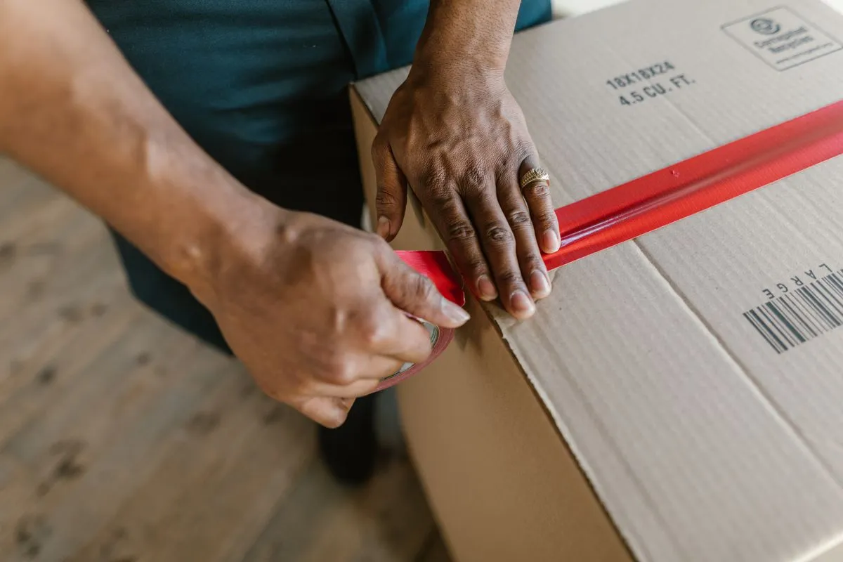 Labeled boxes and packed appliances inside a portable storage container
