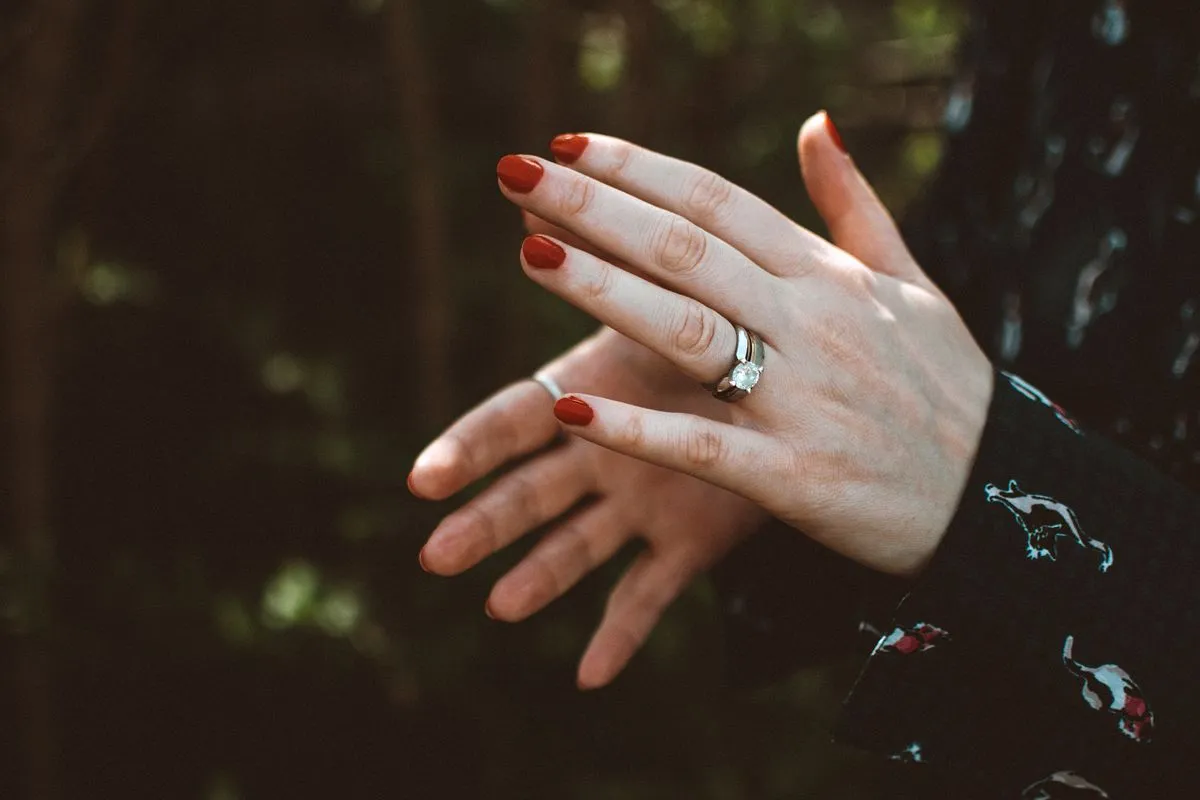 Close-up of glossy wedding nails with refined shaping