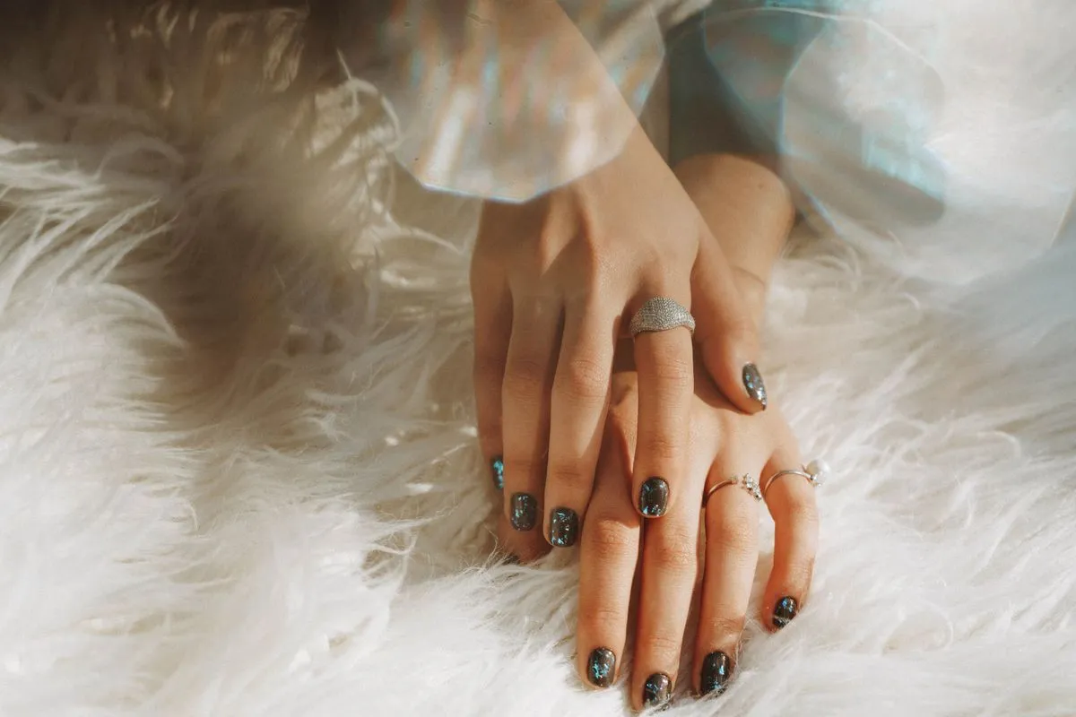 Close-up of modern nail art on gel nail extensions