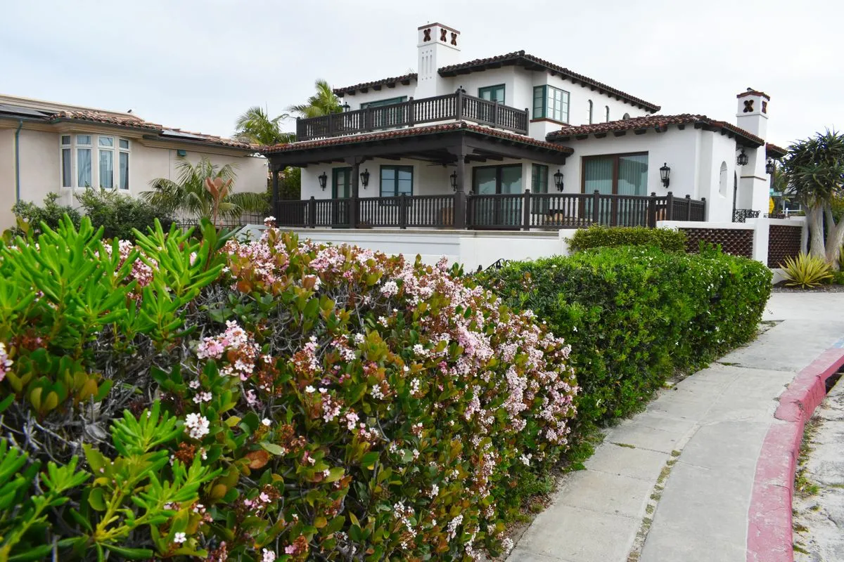 Modern waterfront estate exterior presented through high end property marketing